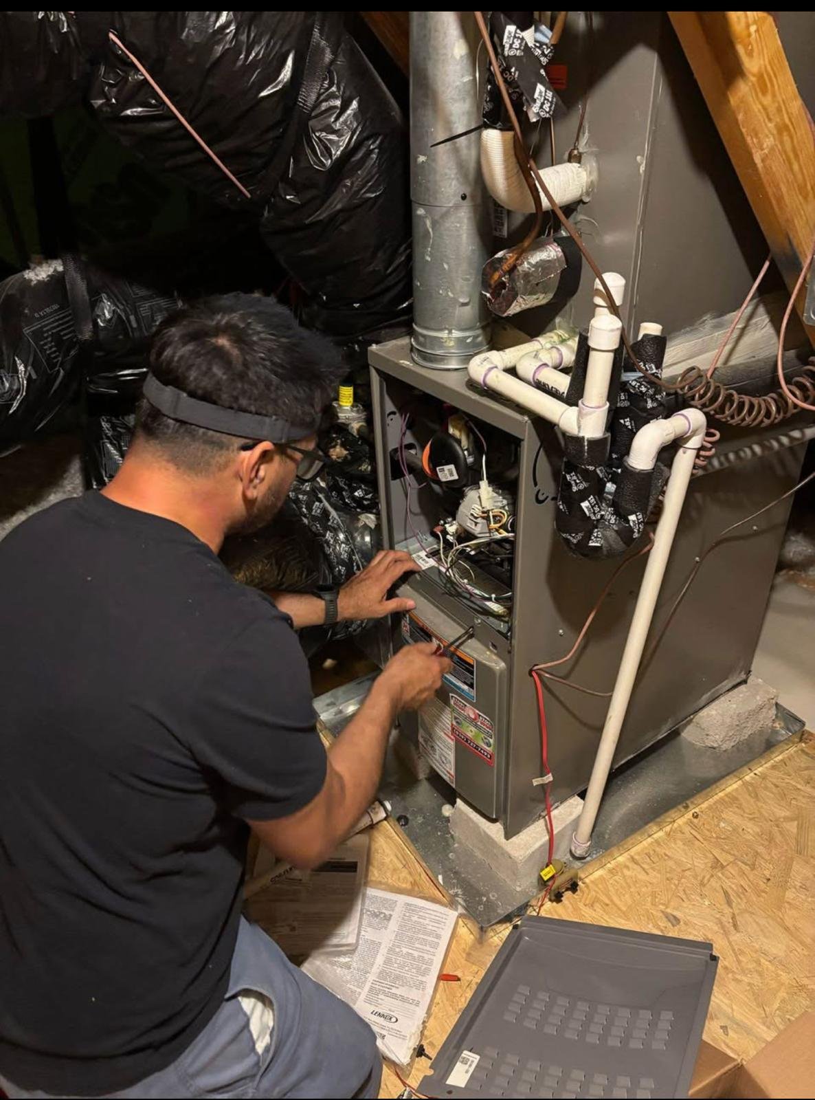 ClimaForce technician servicing a furnace system